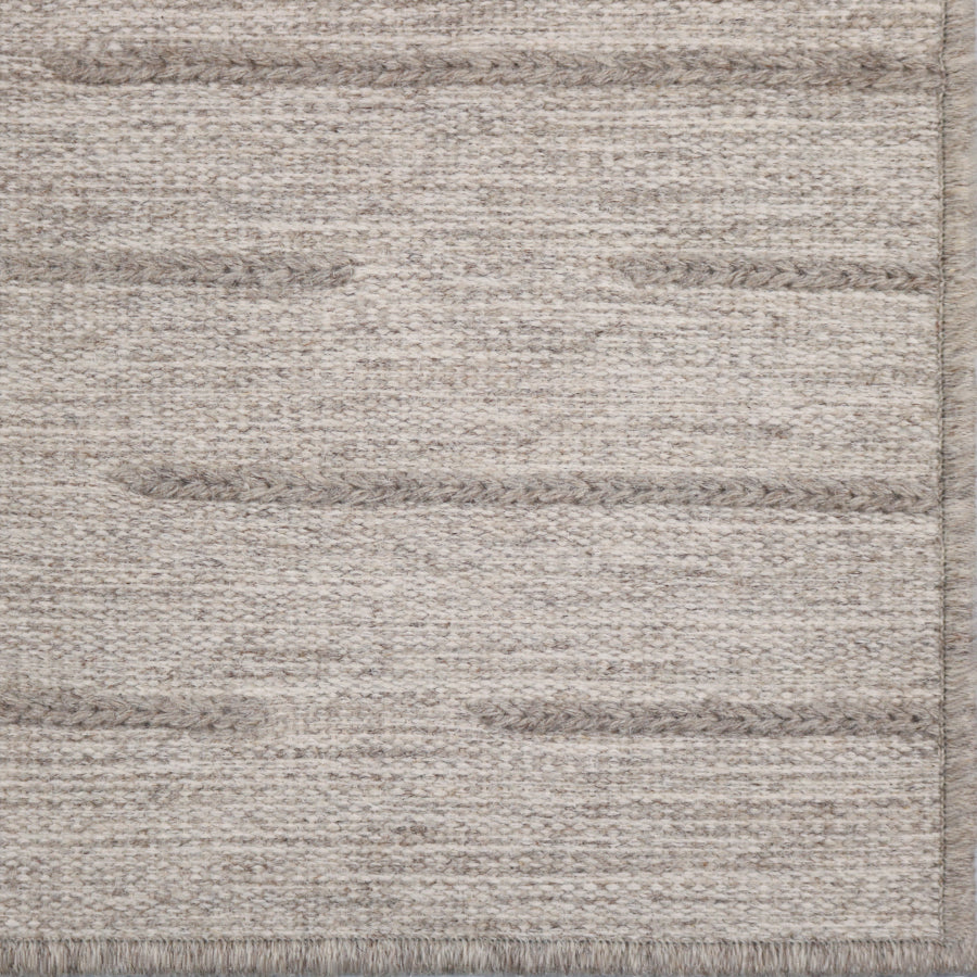 Textured rug with horizontal stripes in neutral colors