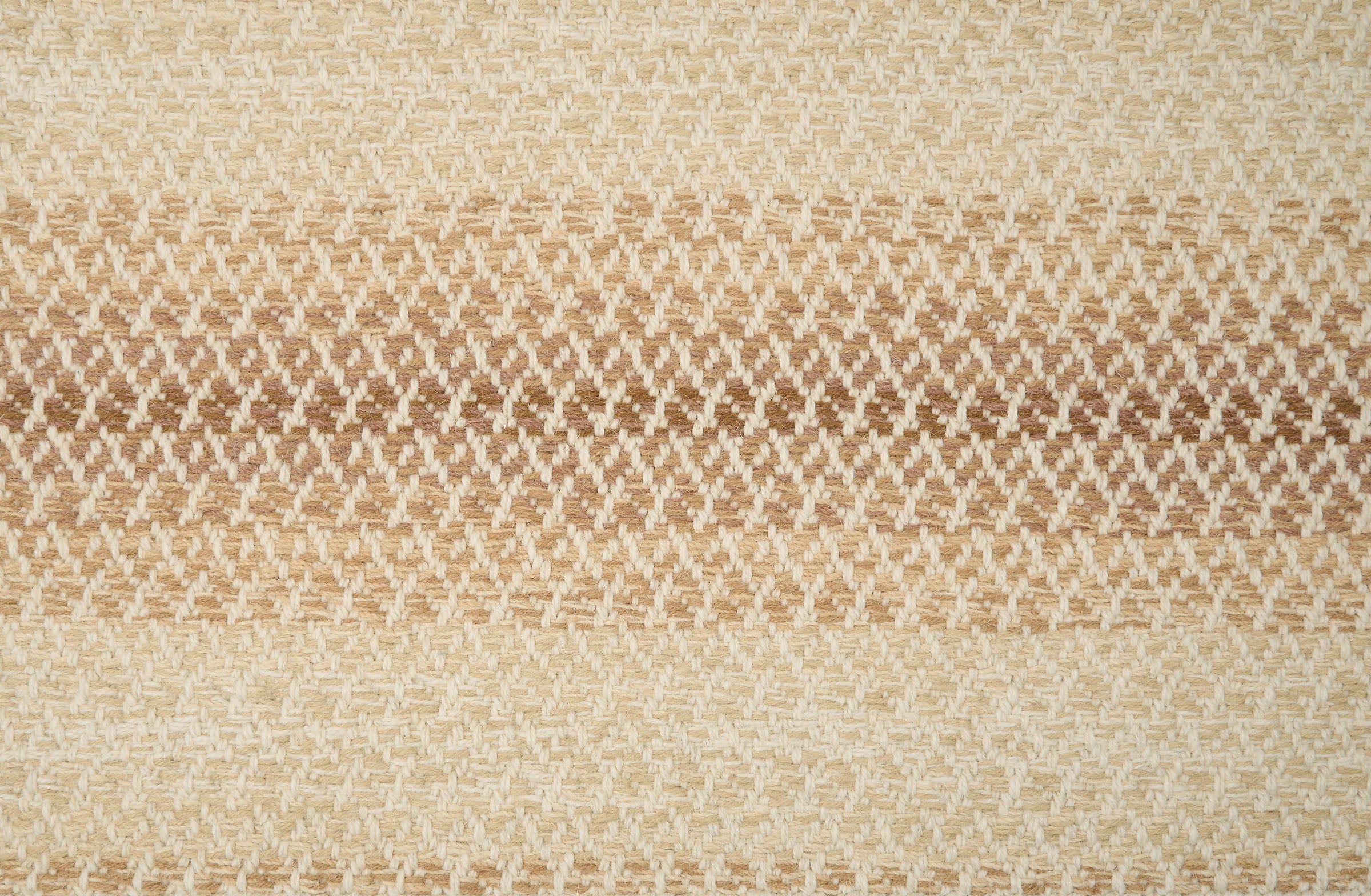 Textural broadloom with an ombré stripe in tan. 