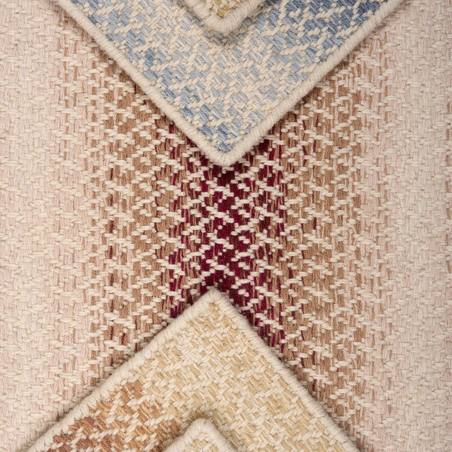 Textural broadloom samples with ombré stripes in various colors.