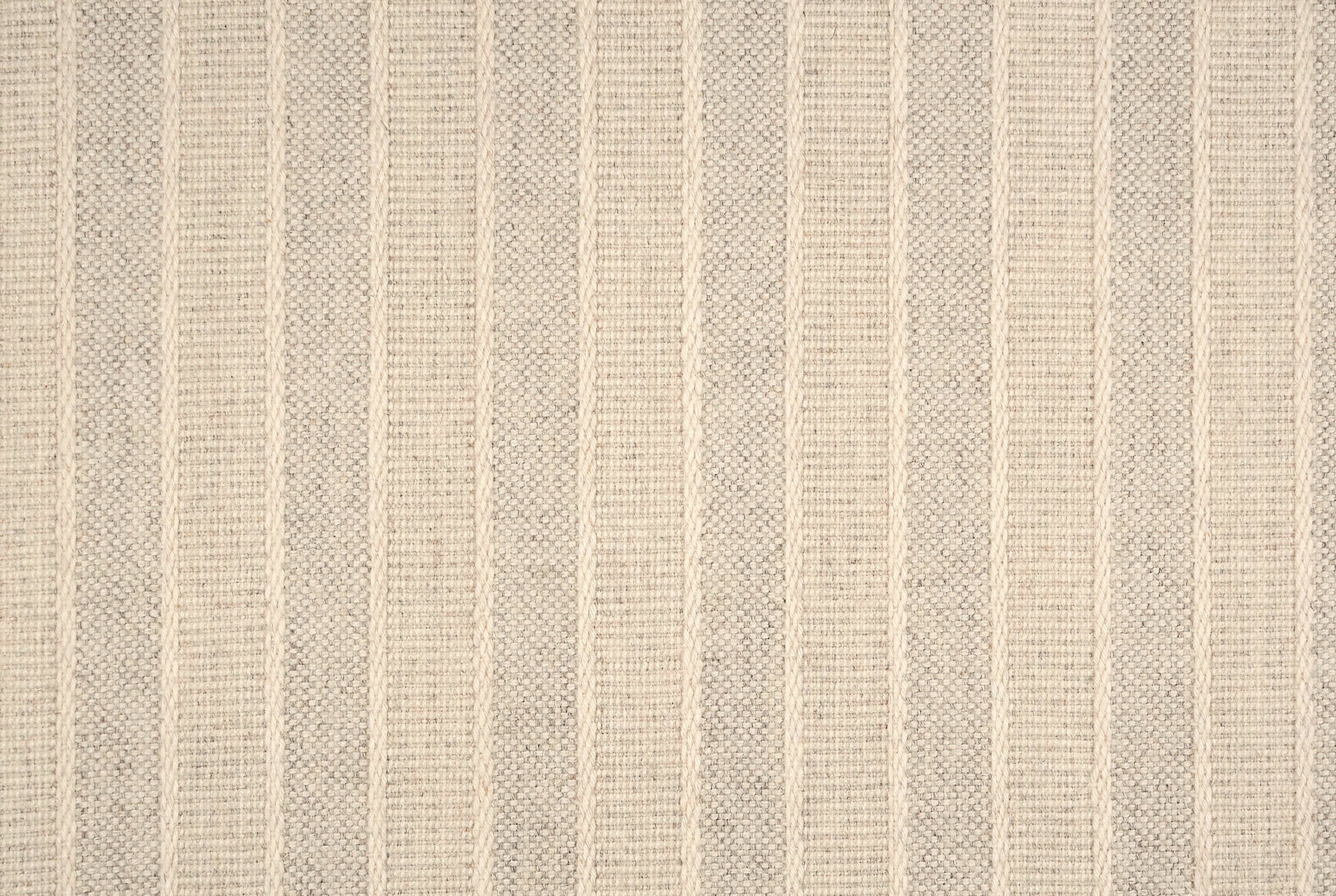 Broadloom carpet in cream textural stripes.