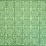 Detail of fabric in a damask lattice print in white on a green field.