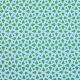Detail of fabric in a geometric lattice print in green on a light blue field.