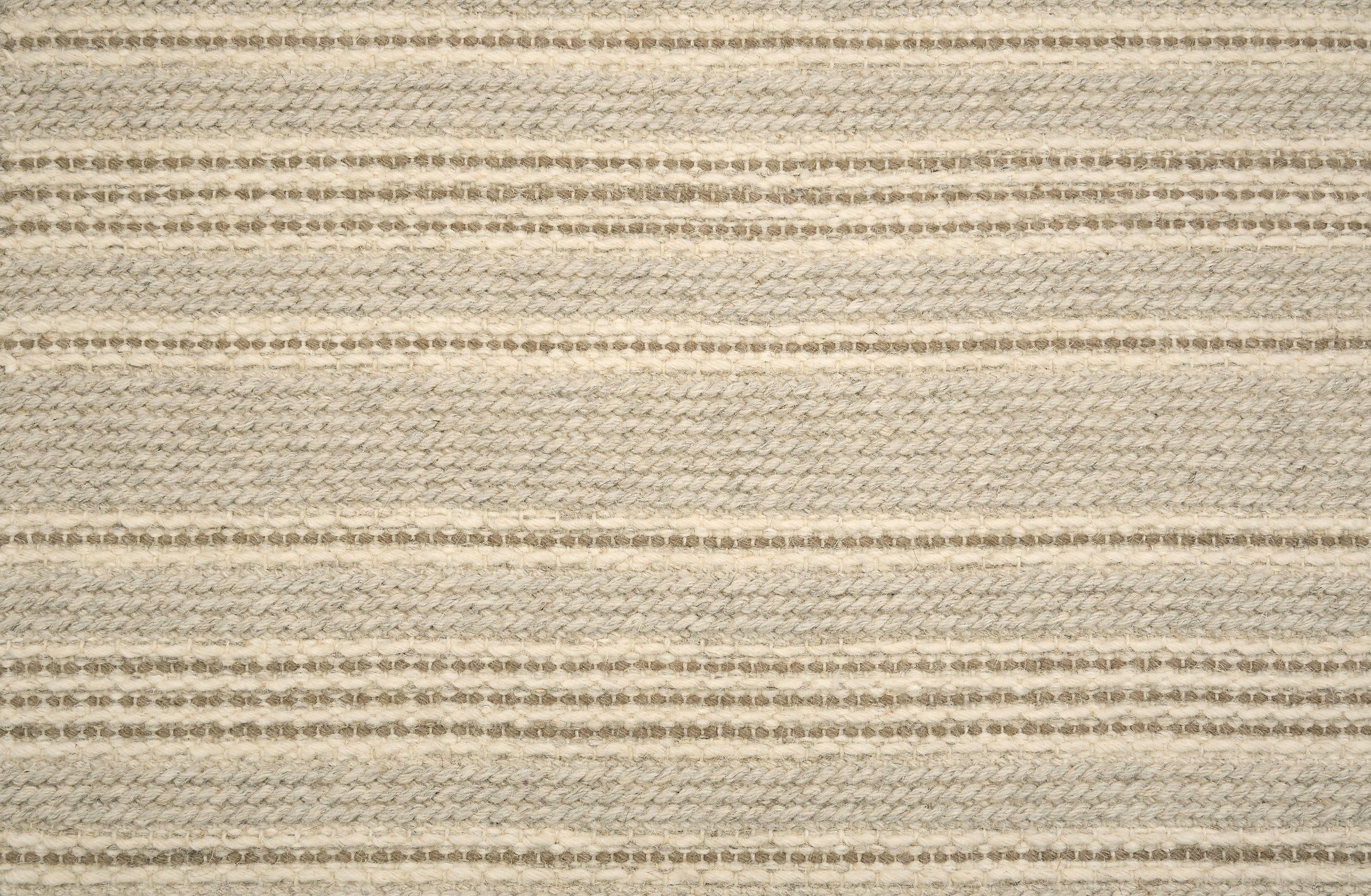 Broadloom carpet in beige with taupe stripes.