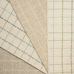 Stack of four broadloom carpet with windowpane plaid pattern in neutral and pastel colors.