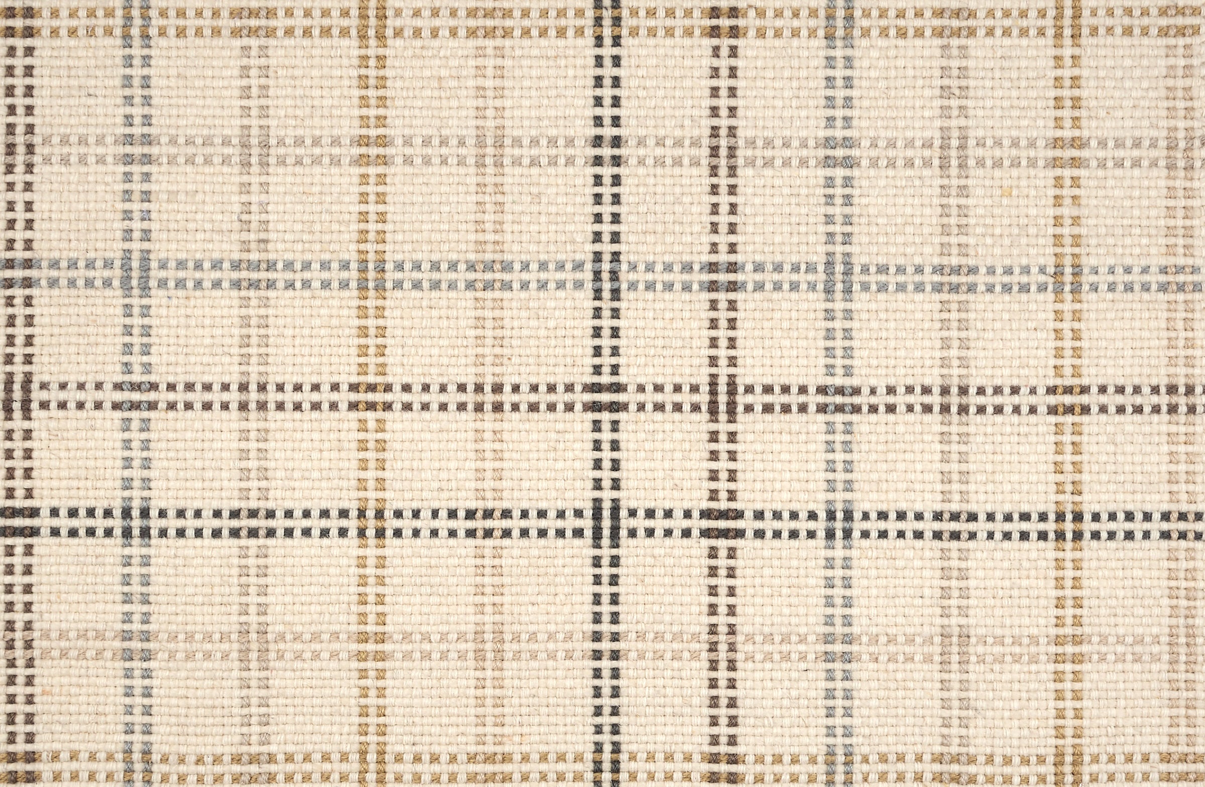 Broadloom carpet in a dashed window pane plaid in shades of blue and brown on a cream field.