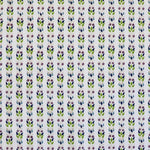 Detail of fabric in a striped botanical print in shades of blue, purple and green on a cream field.