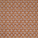 Fabric with small scale floral pattern in white, eggplant and orange.