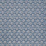 Fabric with small scale floral pattern in white, navy and blue.