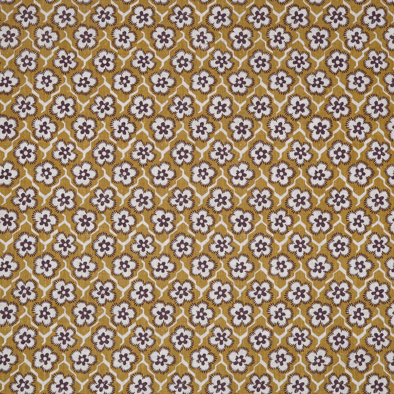 Fabric with small scale floral pattern in white, brown and yellow. 