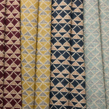 Collection of fabric swatches with geometric triangle patterns in various colors.