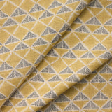 Draped fabric with a tan and navy blue geometric pattern