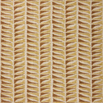 Close-up of fabric with a geometric leaf pattern in brown and beige.