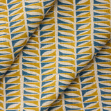 Draped close-up of fabric with a geometric leaf pattern in blue and ochre.