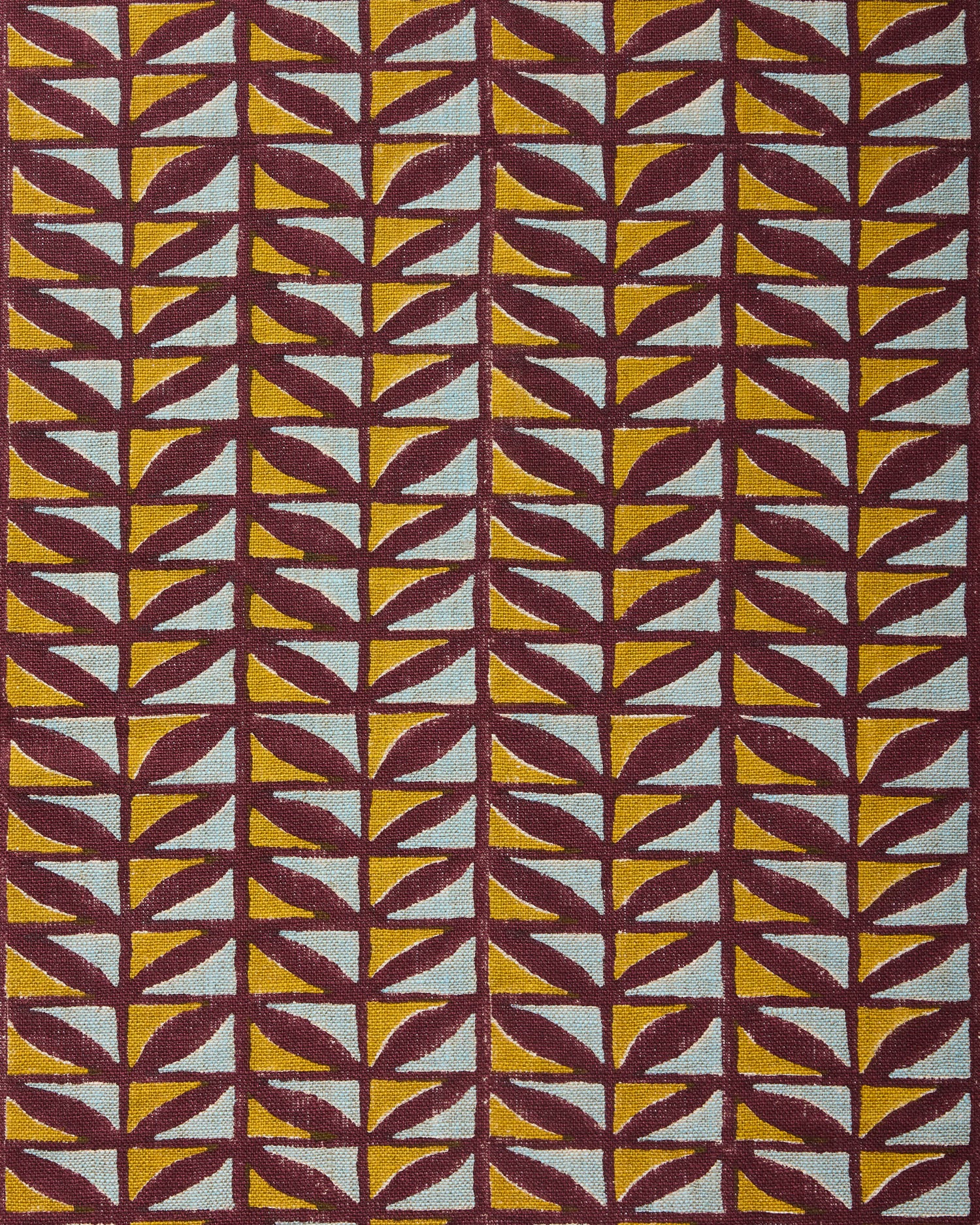 Patterned fabric with geometric design in purple, yellow, and blue.