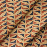 Draped fabric with a geometric triangle pattern in red, blue, and beige.