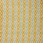 Textile pattern with yellow and green design on a fabric background