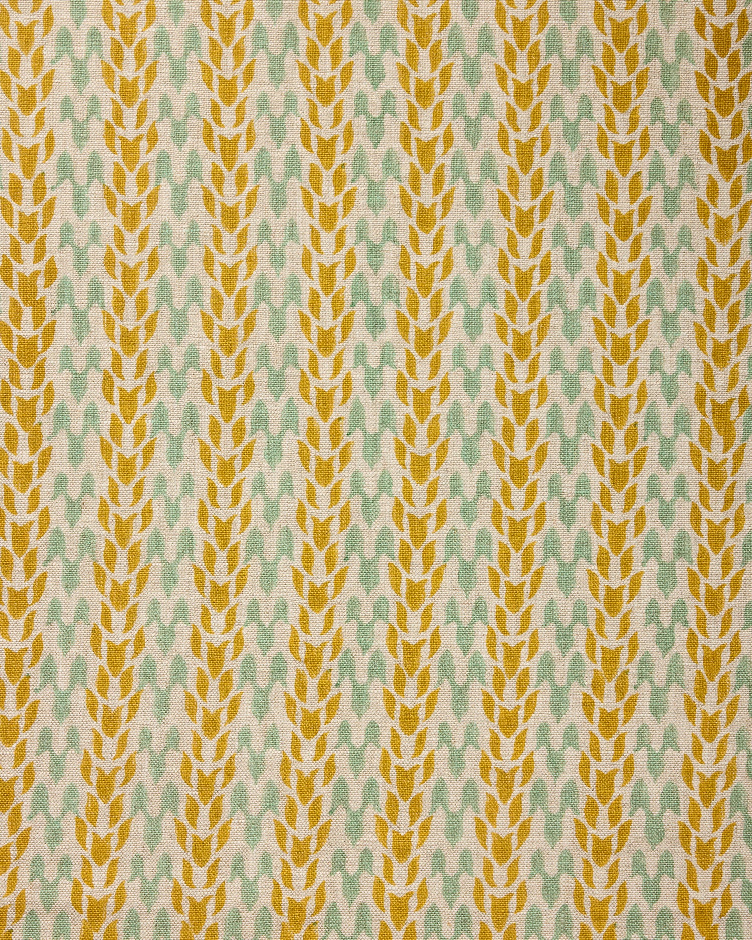 Textile pattern with yellow and green design on a fabric background