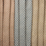 Three fabric swatches diamond pattern in red, blue and tan.