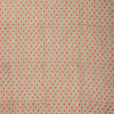 Textile pattern with small diamond shapes in red on a beige background