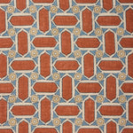 Fabric with geometric mosaic pattern of red, blue, and beige colors.