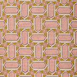 Fabric with geometric mosaic pattern of pink and green.