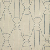 Woven fabric swatch in a repeating curvolinear print in navy on a tan field.