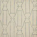 Woven fabric swatch in a repeating curvolinear print in navy on a tan field.