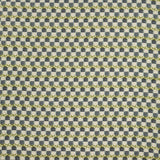 Woven fabric swatch in a repeating mosaic print in shades of green and gray-blue on a tan field.