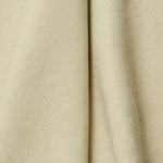 A draped swatch of linen fabric in a solid pale green color.