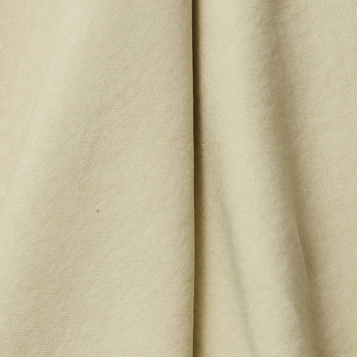 A draped swatch of linen fabric in a solid pale green color.