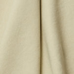 A draped swatch of linen fabric in a solid pale green color.