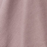 A draped swatch of linen fabric in a solid mauve color.