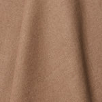 A draped swatch of linen fabric in a solid light brown color.