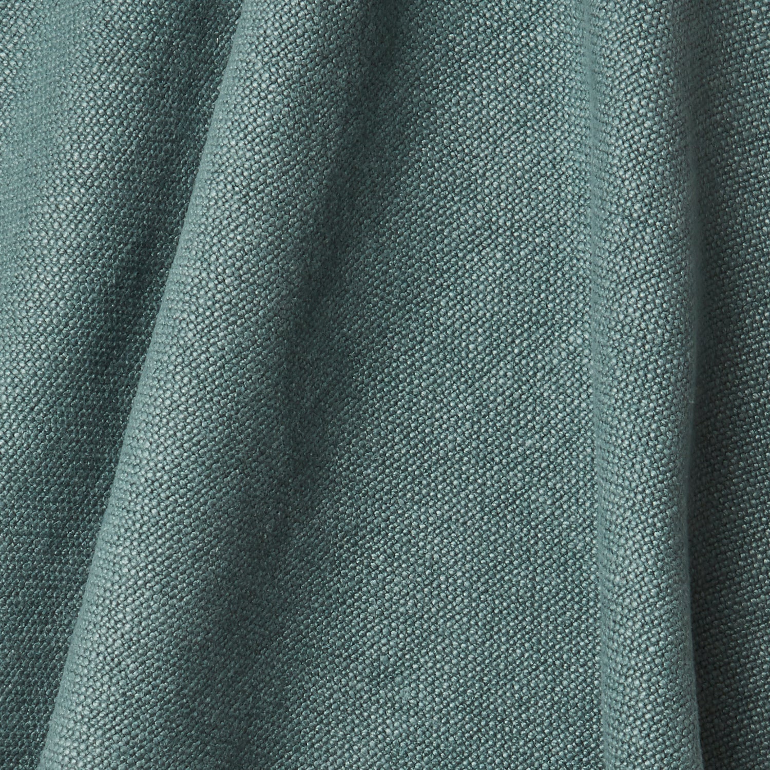A draped swatch of old-world linen fabric in a solid dark green color.
