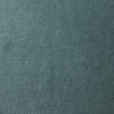 A swatch of old-world linen fabric in a solid dark green color.