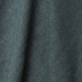A draped swatch of old-world linen fabric in a solid dark green-gray color.