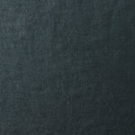 A swatch of old-world linen fabric in a solid dark green-gray color.