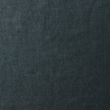 A swatch of old-world linen fabric in a solid dark green-gray color.