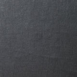 A swatch of old-world linen fabric in a solid dark gray color.
