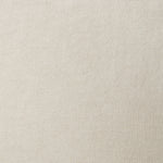A swatch of old-world linen fabric in a solid cream color.