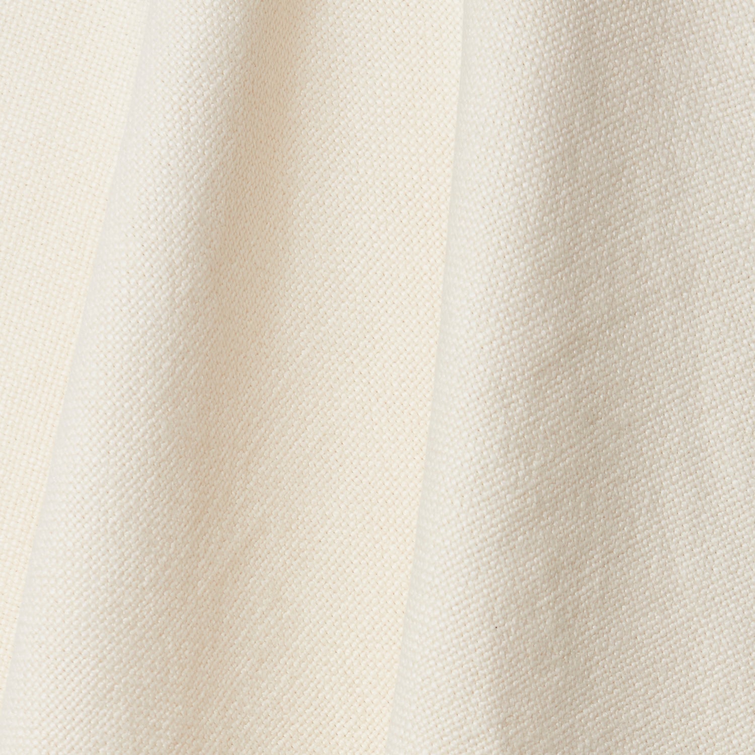 A draped swatch of old-world linen fabric in a solid white color.