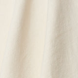 A draped swatch of old-world linen fabric in a solid white color.