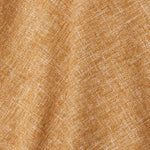 A draped swatch of blended linen fabric in a mottled mustard color.