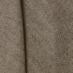 A draped swatch of linen fabric with a small-scale pattern of diagonal stripes in dark brown and tan.