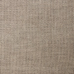 A swatch of linen fabric in a small-scale dotted pattern in tan and dark brown.