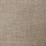 A swatch of linen fabric in a small-scale dotted pattern in tan and dark brown.