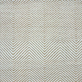 Detail of a handwoven rug in a chevron pattern in natural raffia and ivory yarn