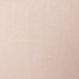 A swatch of blended linen fabric in a solid pale pink color.
