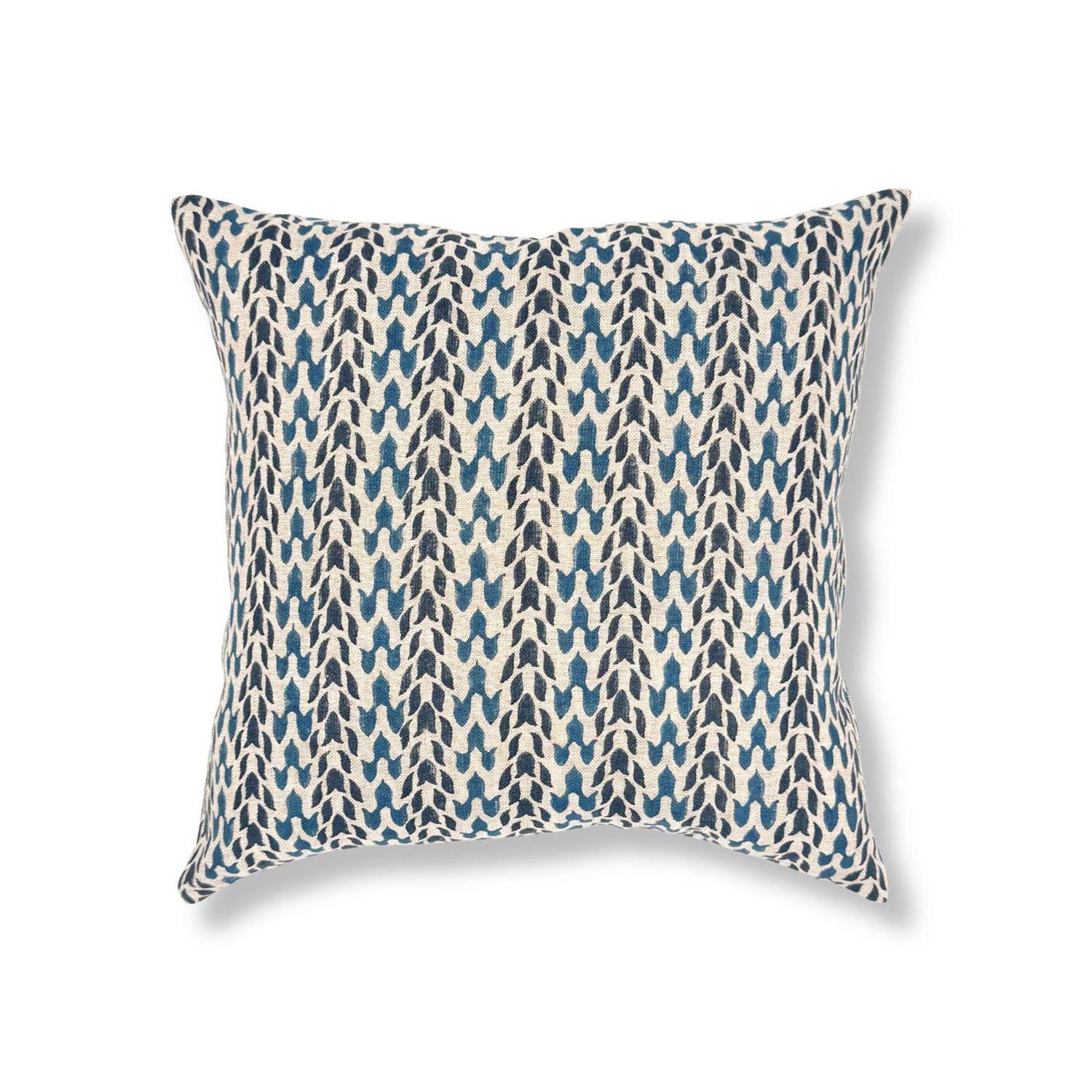 Block printed pillow with organic petal pattern in shades of blue. 