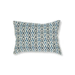 Block printed lumbar pillow with organic petal pattern in shades of blue. 